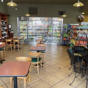 The eating area to the left of the pasta supplies and deli.