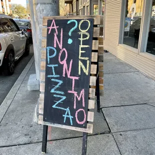 a sign on a sidewalk