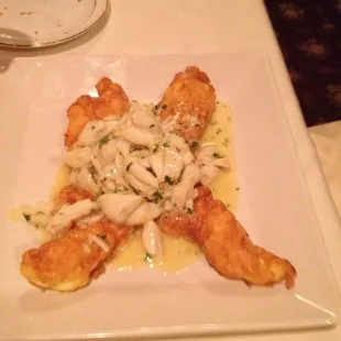 Lobster romano topped with crab in a butter and garlic cream sauce