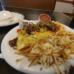 Mexican omelet was well endowed with fresh hash browns, not the frozen packaged kind. And the biscuits and gravy were the best I&apos;ve ever had
