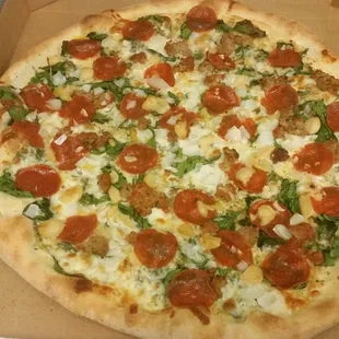 Every pizza dough is stretched by hand when you order. Fresh spinach and roasted garlic are just two of our unique topping choices.