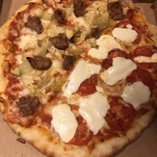 Half sausage with artichoke heart, half heirloom tomato with mozzarella. I would do the second half every day!