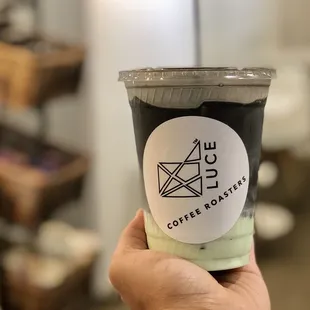 Charcoal infused pandan latte