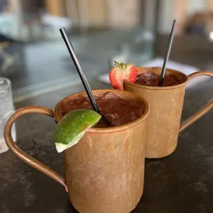 Regular Moscow Mule and Strawberry Mule. Deep mugs, ice cold, and soo delicious and refreshing!!