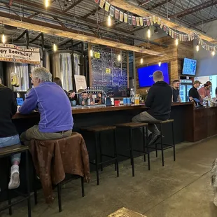 people sitting at the bar