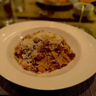 a plate of pasta with meat and cheese