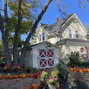 a house with pumpkins in front of it