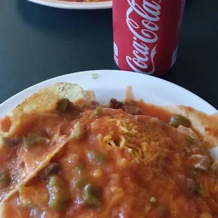 Ladies and Gentlemen, I present to you, The Smothered Combination Plate.  (Bean burrito, bean tostado and beef taco).  #Heaven #IceColdCoke