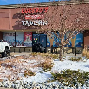 a truck parked in front of a restaurant