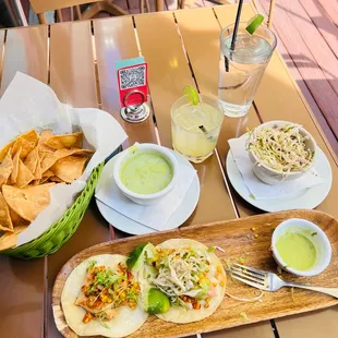 Salmon tacos, fresh chips, Yummy green salsa, a side of spicy slaw &amp; a Pineapple Jalapeño Margarita! All delicious!