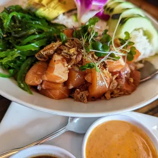 Salmon Poke. $18.99. Raw salmon with sesame, onion, and tamari with seaweed salad, rice, and avocado.