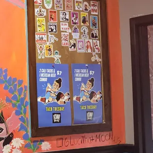 a wall with posters on it