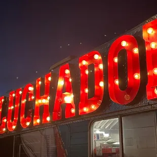 a neon sign for a mexican restaurant