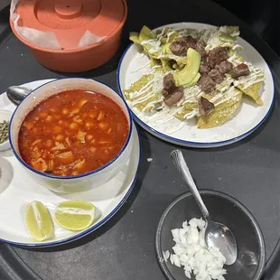 Menudo and spicy green chilaquiles with ribeye steak