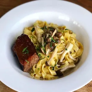 Housemade heritage grain ribbon pasta, wild mushrooms, braised beef shortrib + au jus