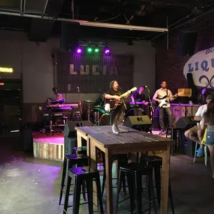 Stage in back of the bar.