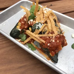 Veggie Special: Two stuffed poblanos covered with a tomato-chili sauce