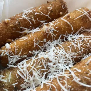 Mozzarella Sticks  Hot &amp; Fresh  The shaved cheese on top is just perfection.