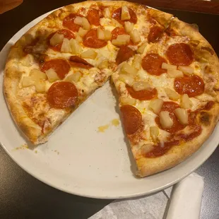  a person holding a slice of pizza