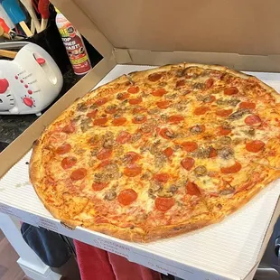 Pepperoni and sausage on a 24" pizza. Its HUGE!
