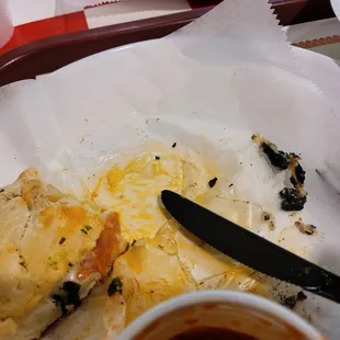 Burnt calzone with hardly any filling in it. They call it "all meat calzone".