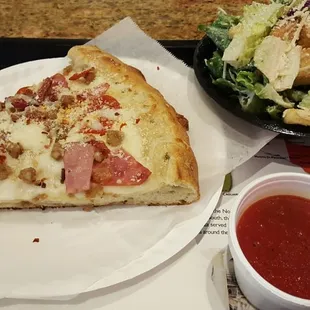 a slice of pizza and salad