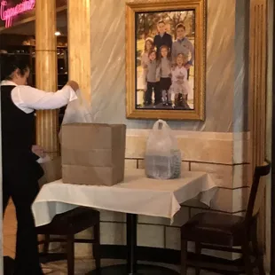 a waiter carrying a box