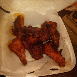 chicken wings in a styrofoam container