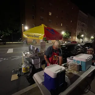 a man selling hotdogs