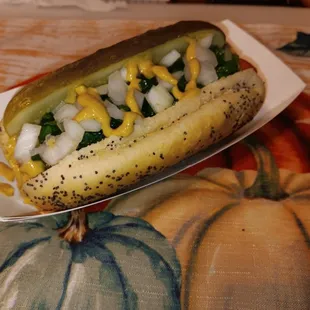 Shy Town Dog Vienna Beef, Poppy Seed Bun, Spicy Brown Mustard, Neon Green Relish, Fresh Chopped Onion, and Celery Seed.
