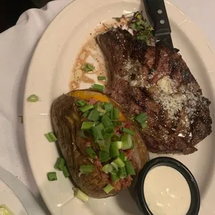 Steak and loaded baked potato! Comes with a salad as well. My sister got this medium well and she absolutely loved it!