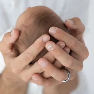 Newborn baby - I showing how tiny babies are compared to your hands.