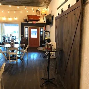 a dining area with a barn door