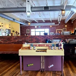 Just inside to the right of the entrance.