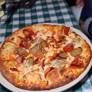 Pepperoni, sausage and bacon pizza