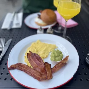 A La cart items: 2 eggs, 2 pieces bacon, side of avocado