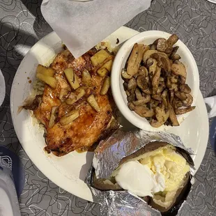 Teriyaki chicken on uncooked rice pilaf, sautéed mushroom &amp; baked potato