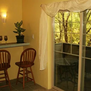 Enjoy wine inside at the wine bar or on the deck. Many people say this deck reminds them of a tree house.