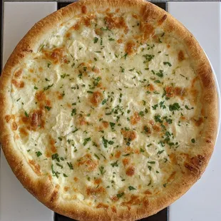 Classic white pizza! House dough topped with fresh garlic herb oil, parmesan cheese, ricotta cheese, and mozzerella cheese!