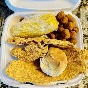 2 piece fish dinner with 2 sides and a roll.