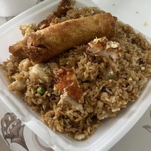 Combination fried rice(with shrimp and chicken) with a crispy egg roll ontop
