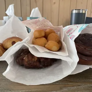 Kolaches, donut holes, cinnamon roll, apple fritter