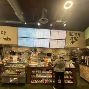 a woman standing in front of the counter