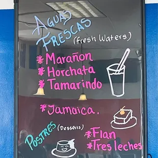 Agua Frescas and dessert menu board.