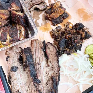 a tray of meat and vegetables