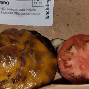 a burger and a tomato