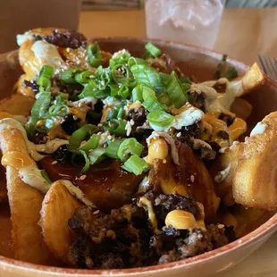 Luck's Loaded Wagyu Fries   $8.25 Batter fries topped with teriyaki wagyu beef, Luck's sauce, sesame, serrano aioli, and green onions