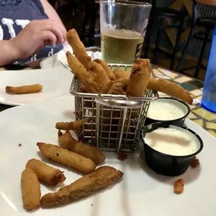 a basket of deep fried french fries
