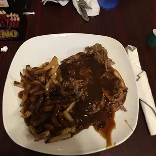 a plate of steak and french fries