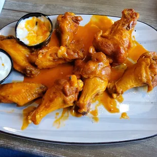 Buffalo Wings traditional the sauce can be a bit more spice. And the larger size wings need more cooking.